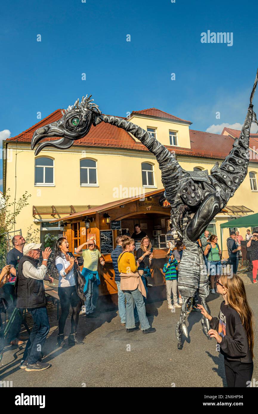 Street Performance of prehistoric giants during the 30th Autumn and Wine Festival Radebeul, Saxony, Germany Stock Photo