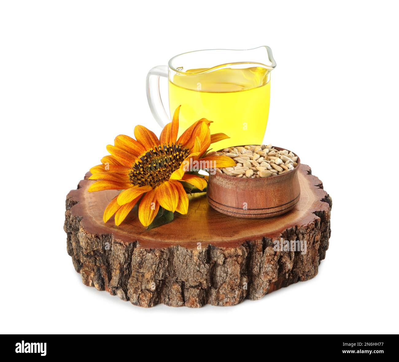 Sunflower, jug of oil and seeds on white background Stock Photo Alamy