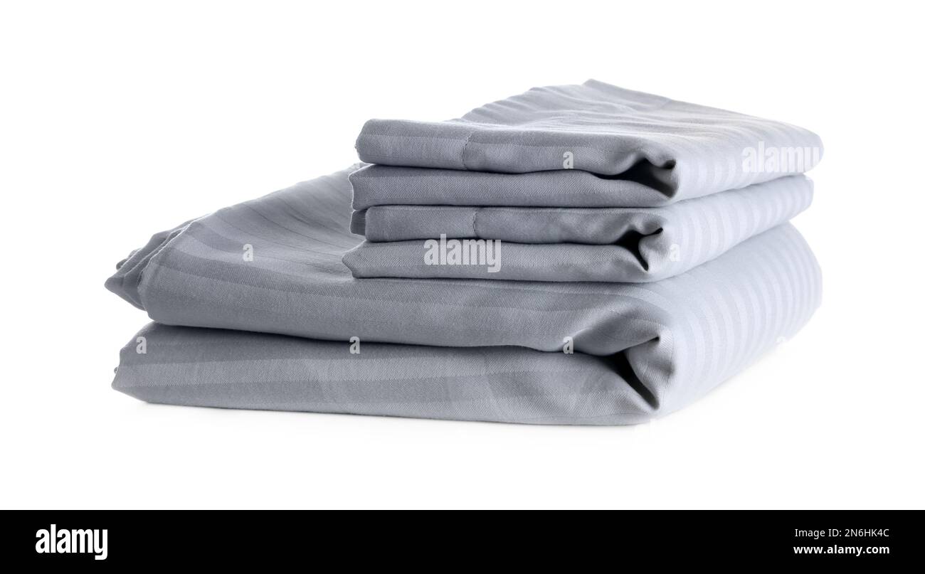 Stack of clean bed sheets isolated on white Stock Photo Alamy