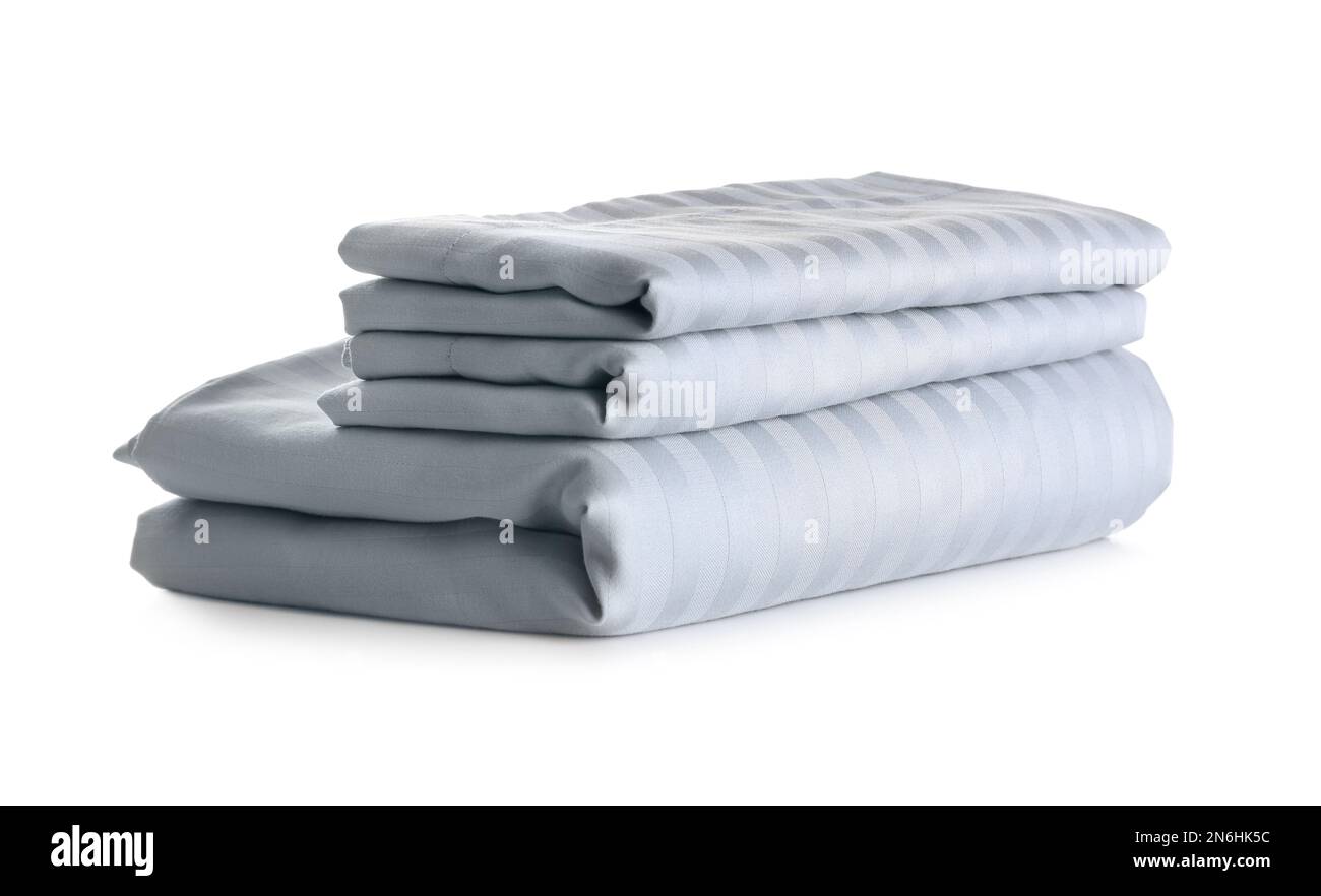 Stack of clean bed sheets isolated on white Stock Photo Alamy