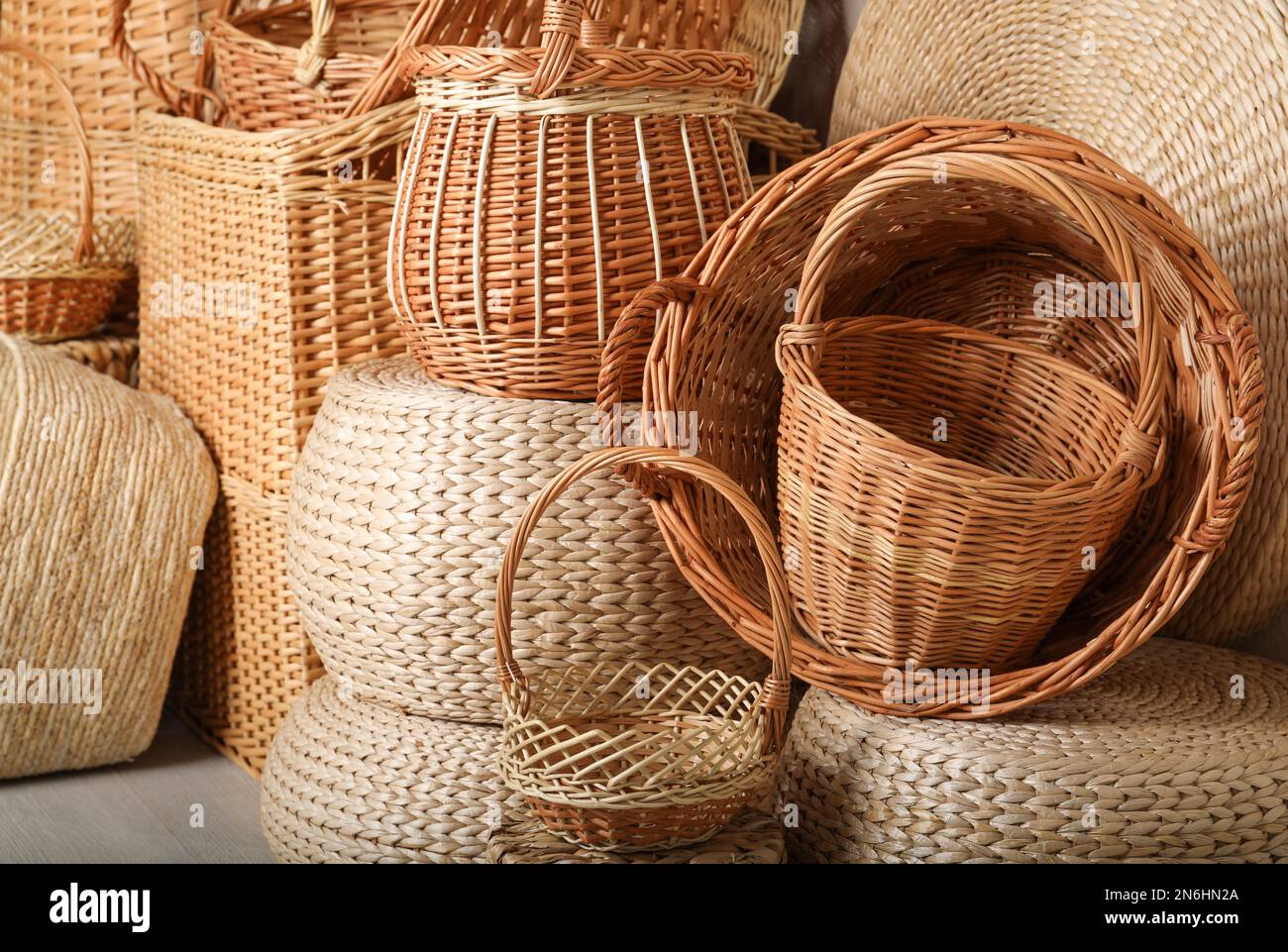 Many different wicker baskets made of natural material as background