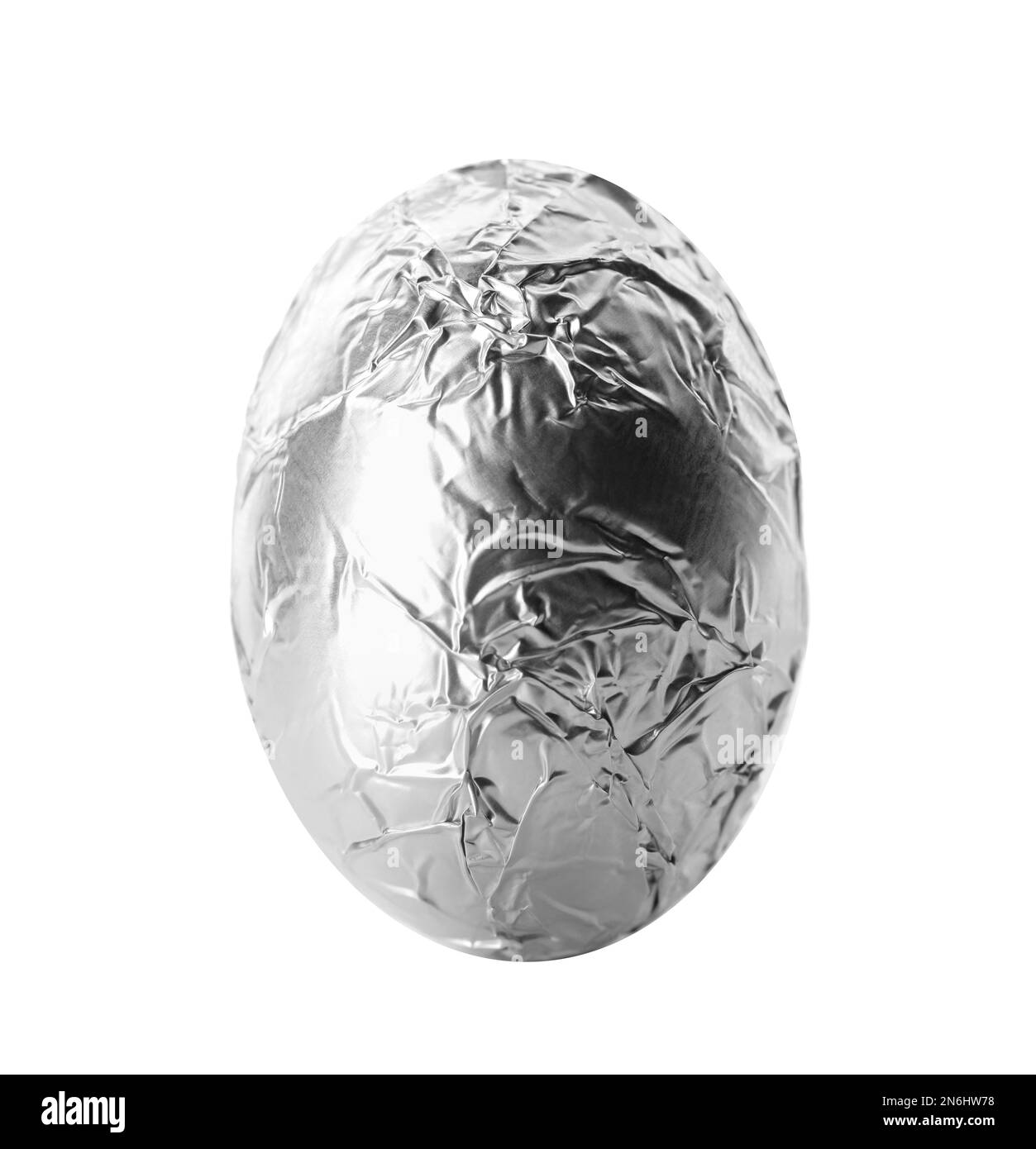 Chocolate egg wrapped in bright silver foil isolated on white Stock