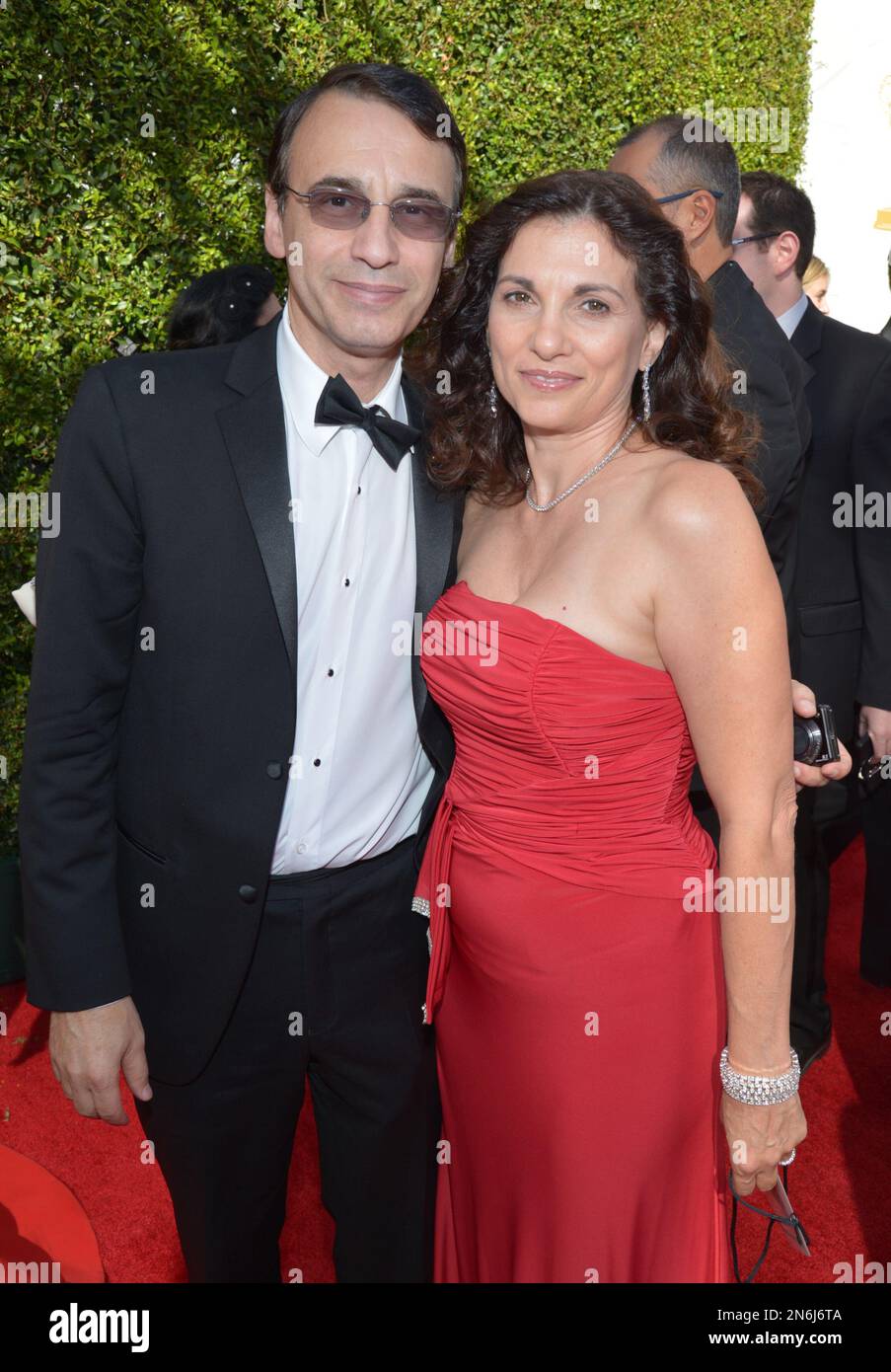 Academy governor Frank Morrone, left and wife arrive at the 65th