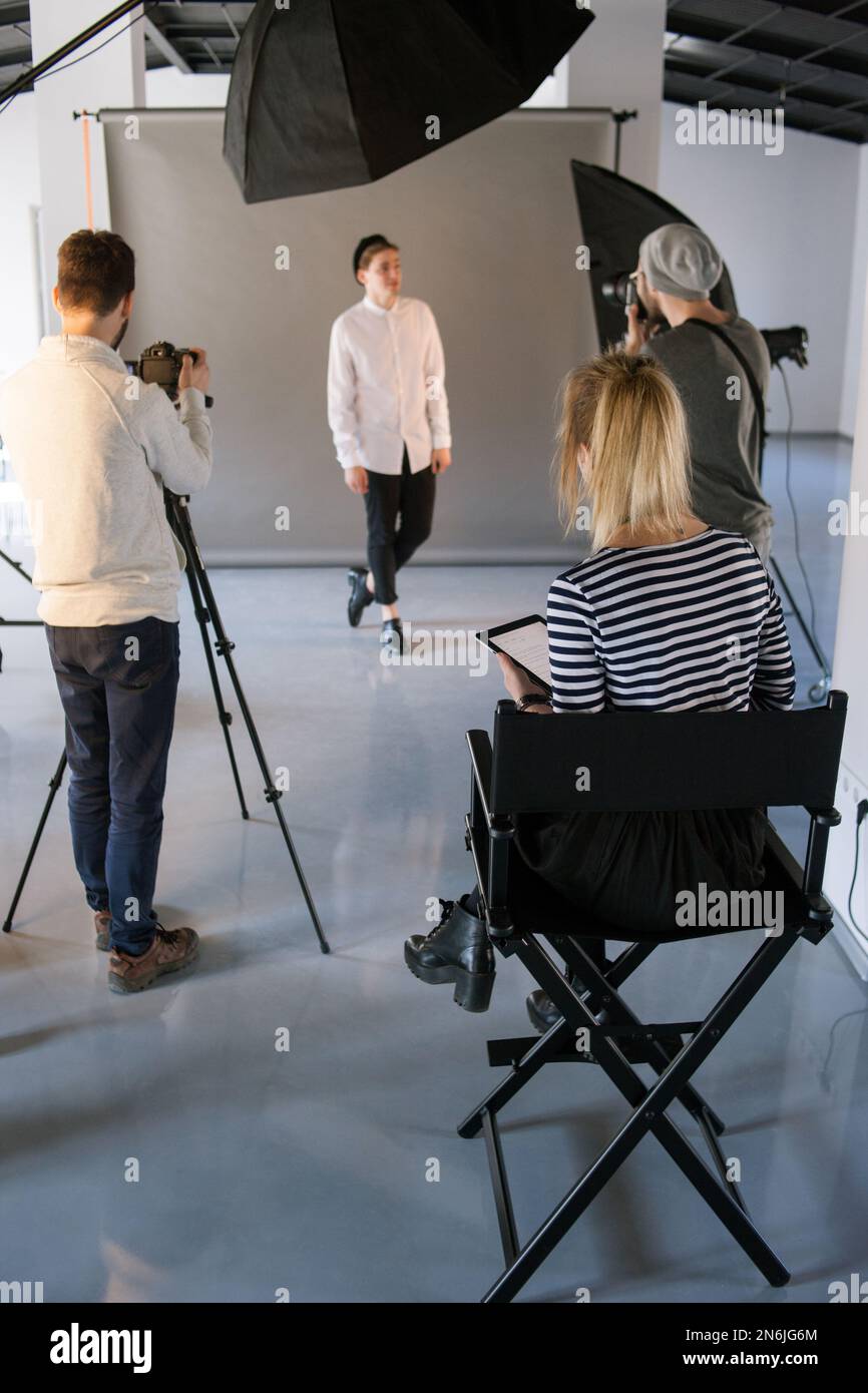 Art director looking over session Stock Photo - Alamy