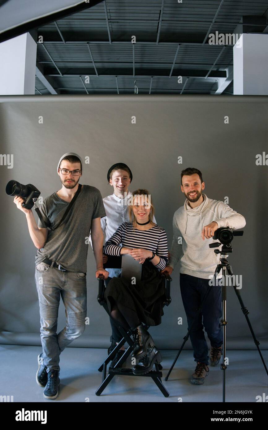 Production Team Example Production team posing in studio Stock Photo - Alamy