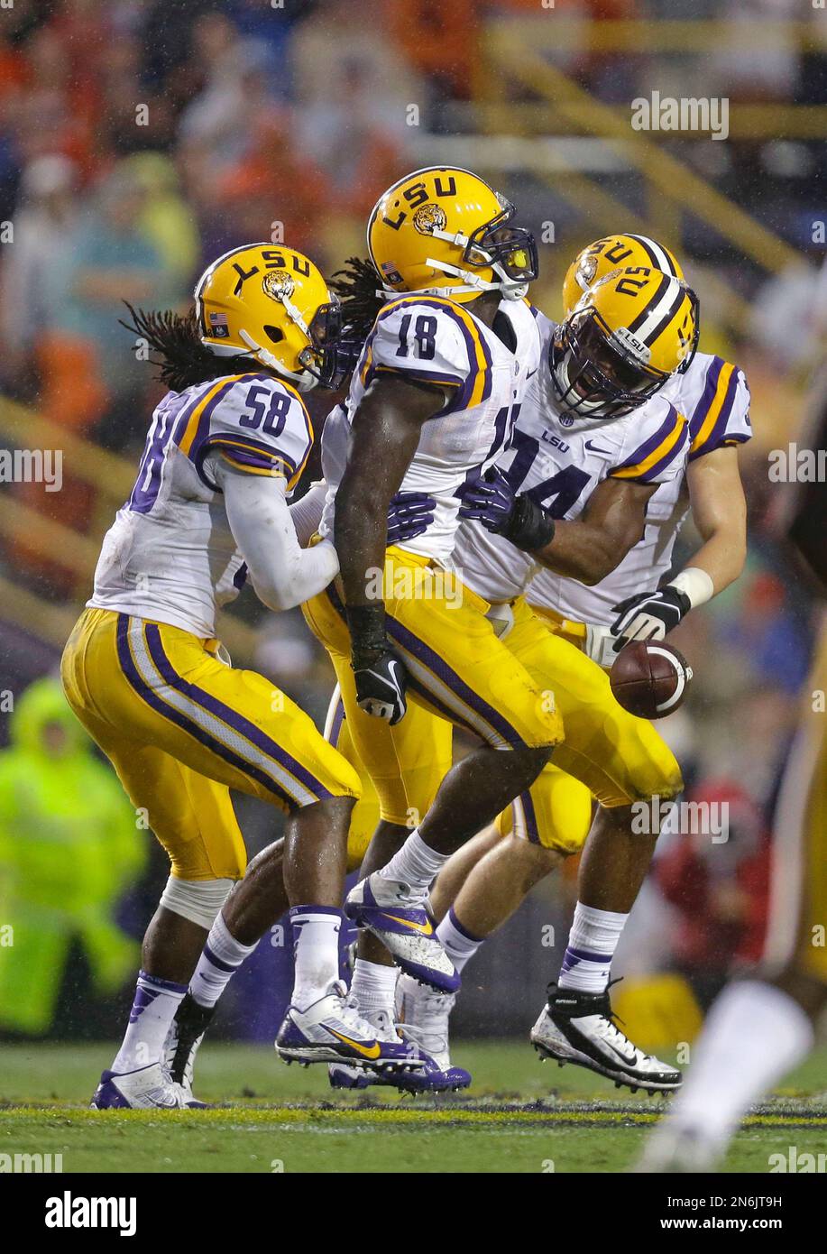 LSU linebacker Tahj Jones (58), linebacker Lamin Barrow (18) and ...