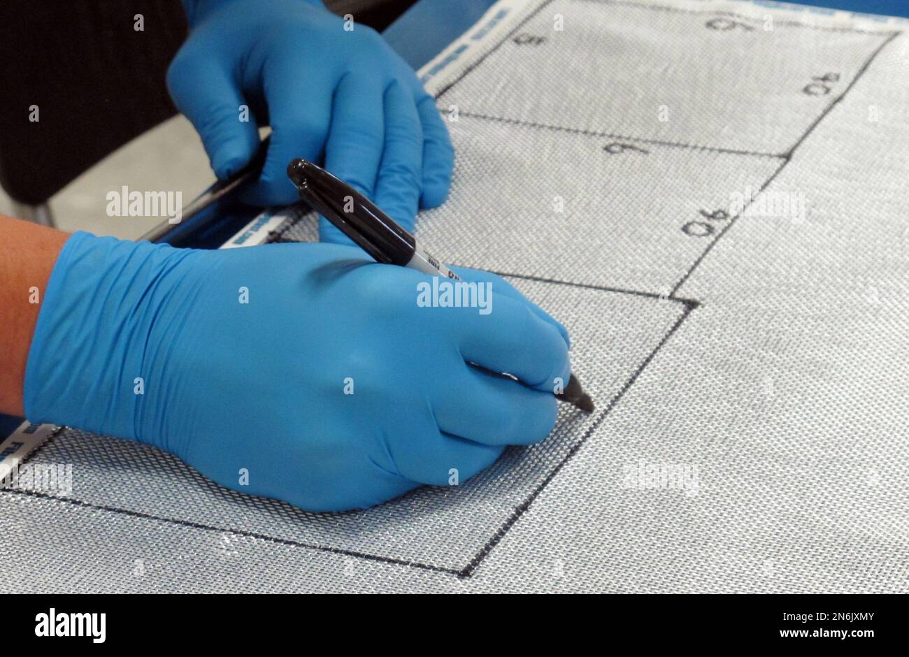 In this photo taken Aug. 29, 2013, an inmate works on aerospace