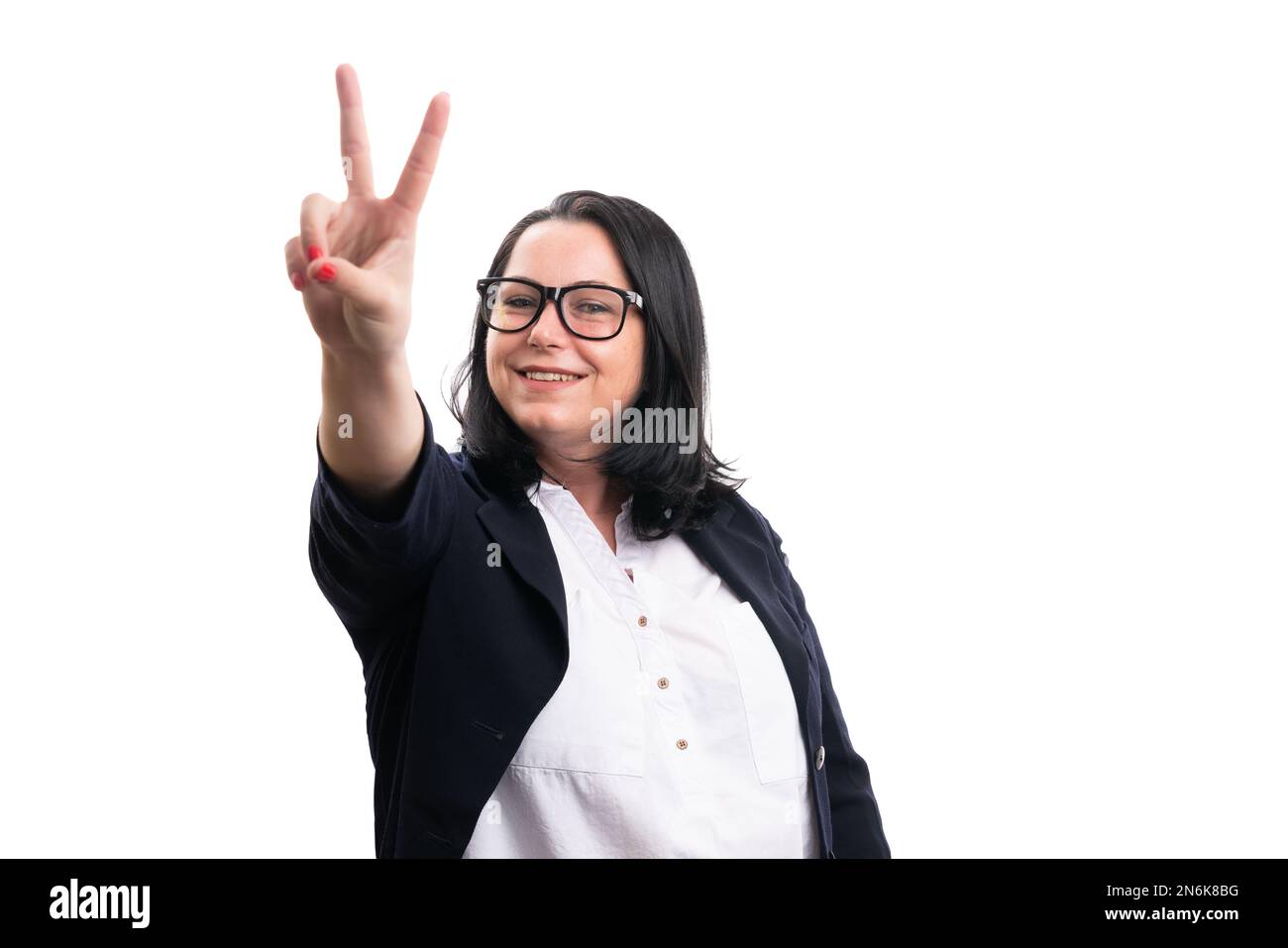 Smiling female model entrepreneur businesswoman making peace or victory sign with fingers isolated on white background blank copyspace for advertising Stock Photo