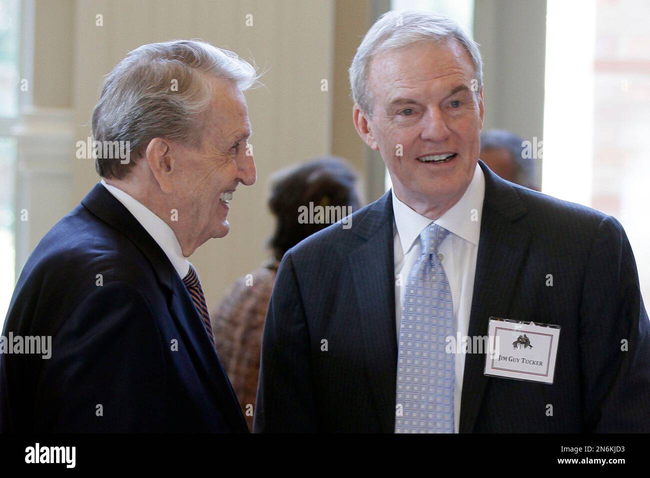 Former Arkansas Gov. Jim Guy Tucker, right, speaks with former U.S. Sen. Dale Bumpers, DArk
