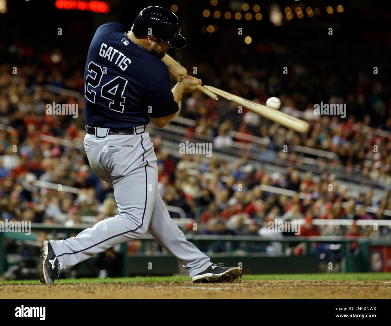 Atlanta Braves' Evan Gattis breaks his bat as he lines out to Washington  Nationals third baseman Ryan Zimmerman who threw to second base for a  double play, during the ninth inning of