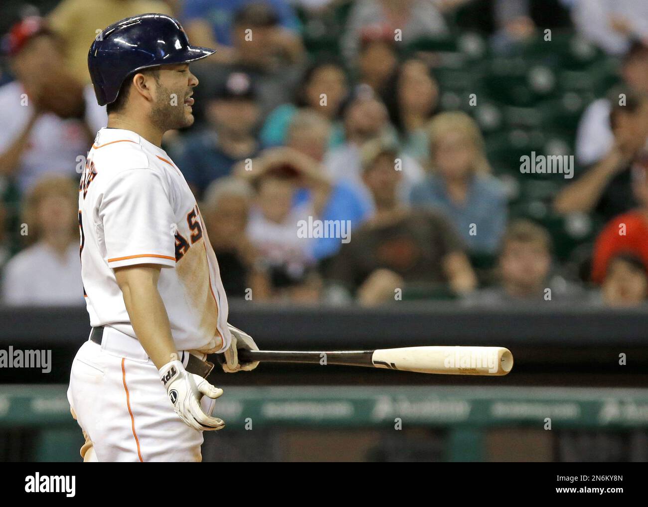 Houston Astros' Jose Altuve sticks out his tongue while grounding