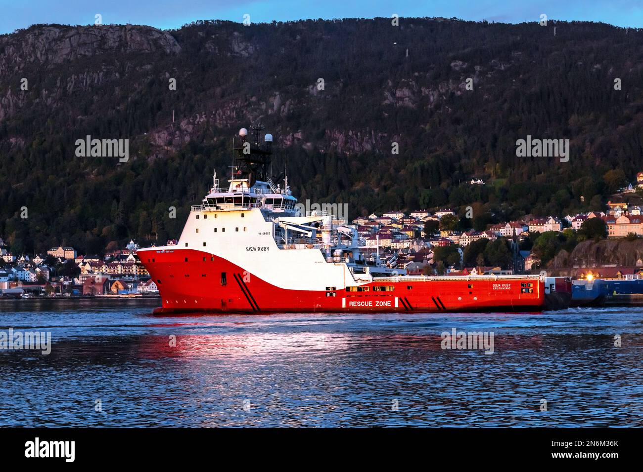 Offshore AHTS anchor handling tug supply vessel Siem Ruby moving into berth at Skoltegrunnskaien, in  the port of Bergen, Norway. Stock Photo