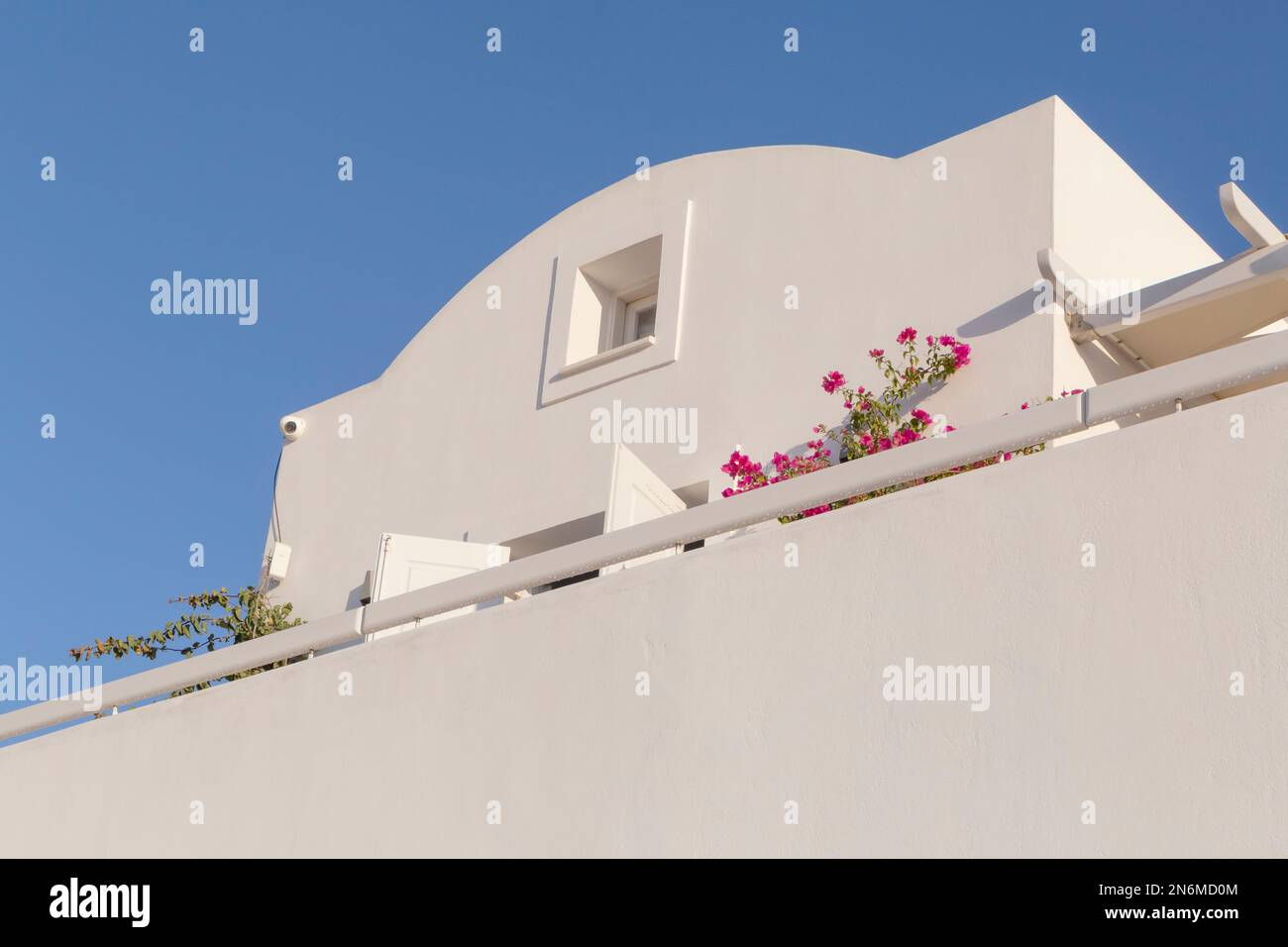 traditional white building on Santorini island in Greece against blue sky Stock Photo