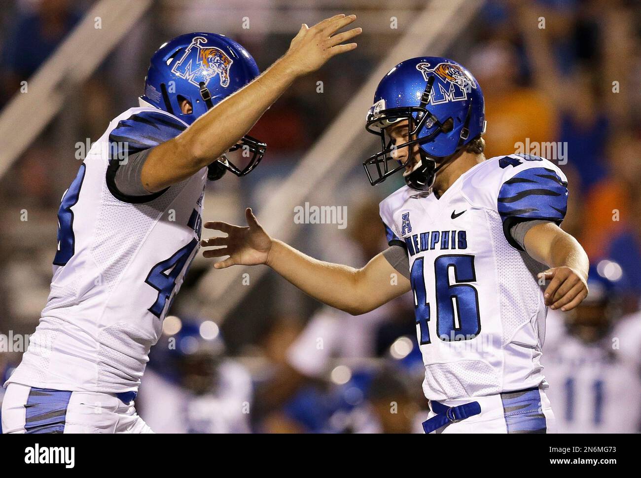 Memphis kicker Jake Elliott (46) celebrates with holder Tom Hornsey, left,  after Elliott kicked a 41-yard field goal against Middle Tennessee in the  second quarter of an NCAA college football game on
