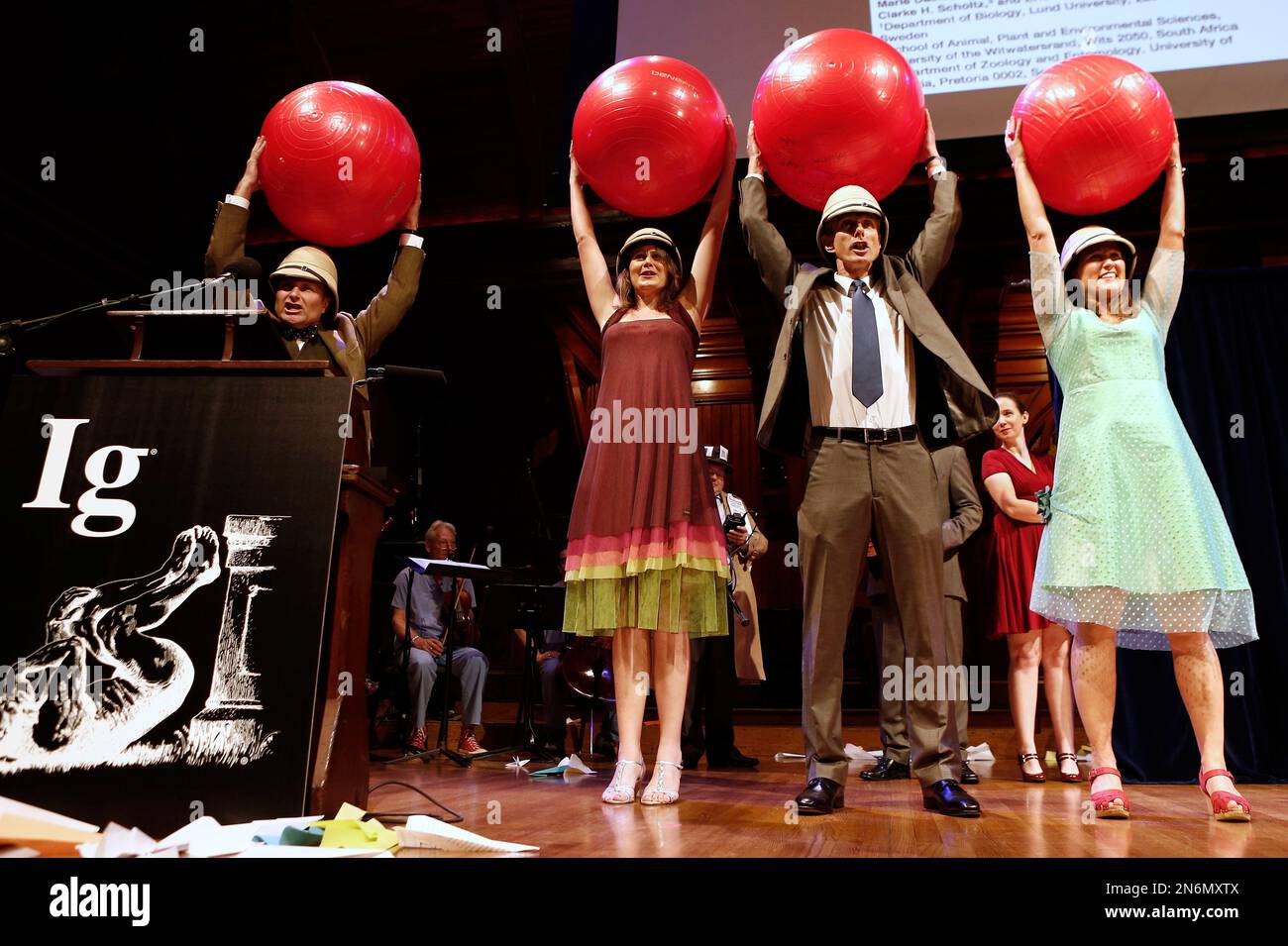 Left to right, Eric Warrant, of Sweden, Emily Baird, of Sweden, Marcus  Byrne, of South Africa, and Marie Dacke, of Sweden ,celebrate winning the  Biology/Astronomy Prize during the annual Ig Nobel prize