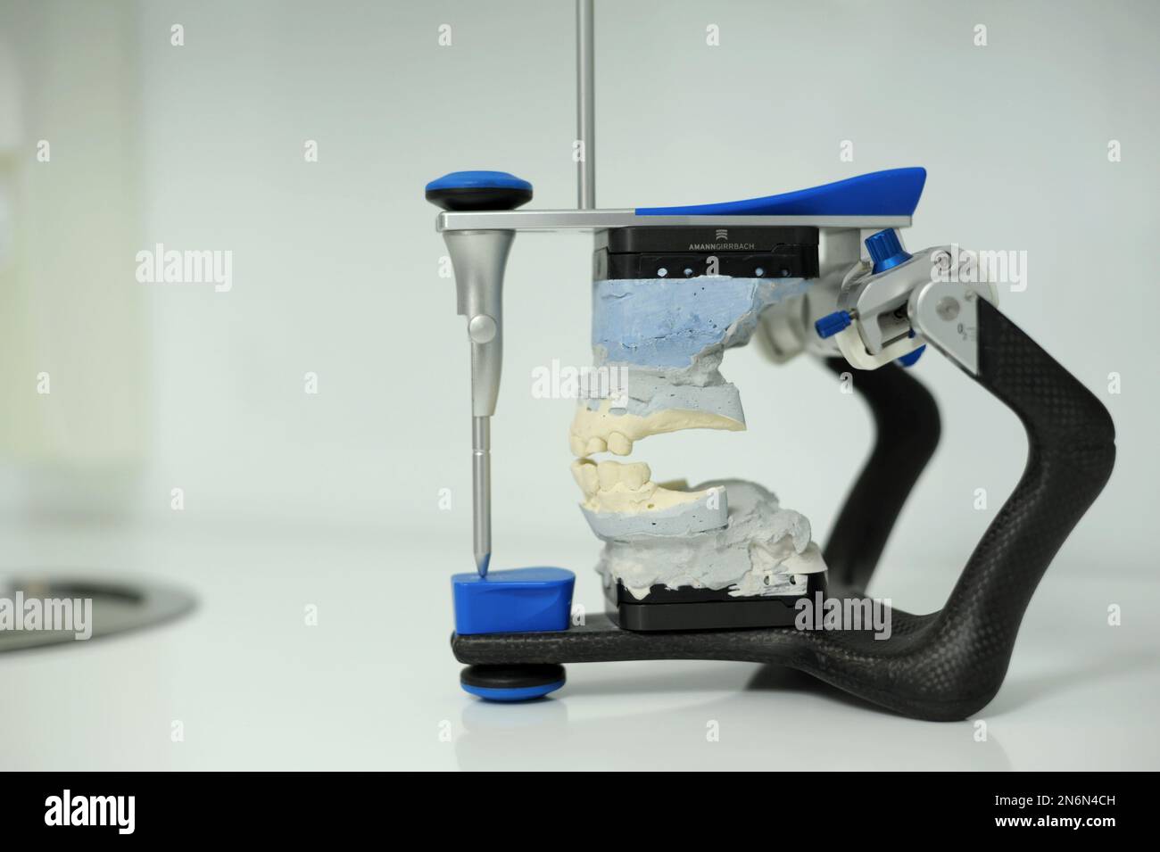 An articulator used in dental laboratories clipped on white background