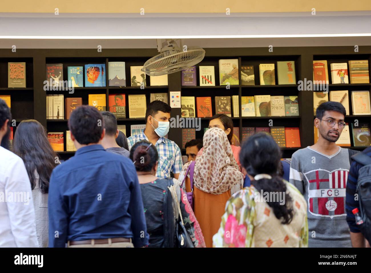 Dhaka, Bangladesh, February 9, 2023. Visitors read books at the