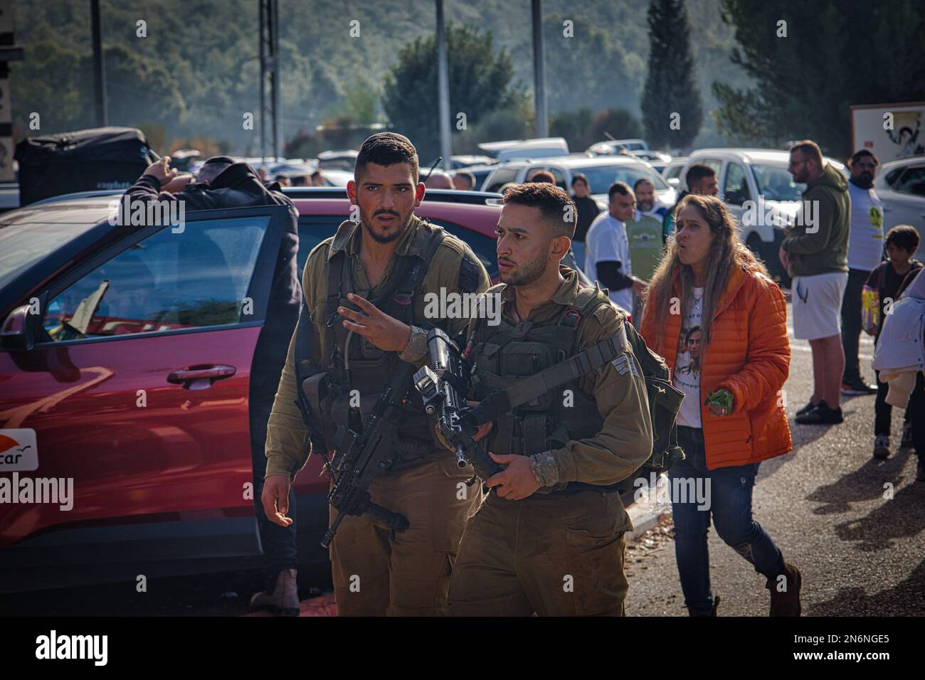 Two Golani soldiers in uniform walking during a demonstration with guns Stock Photo