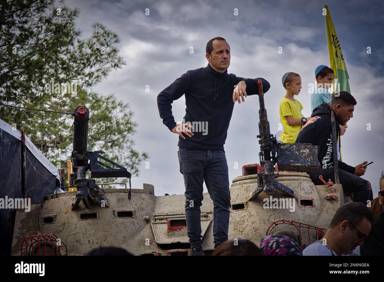 A male standing on top of a tank during Golani soldier ceremony in Israel Stock Photo