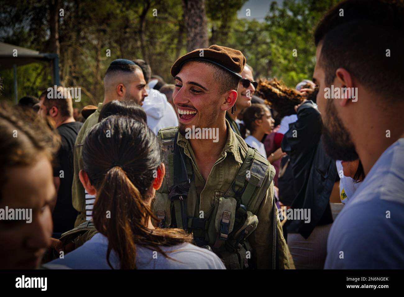 A Golani soldier smiling in uniform during an army ceremony in Israel Stock Photo