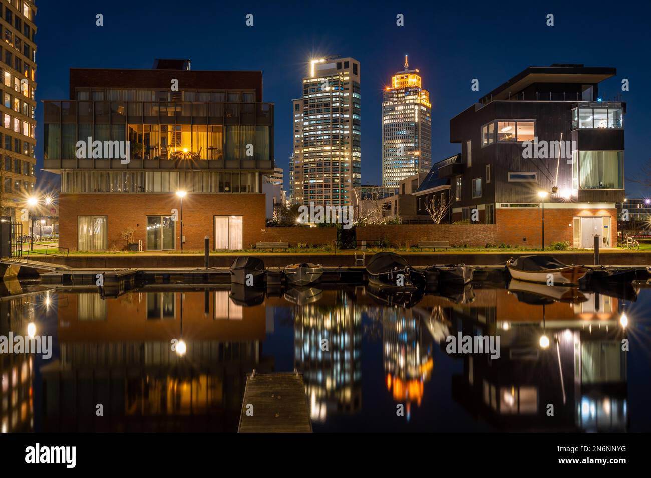 Modern office towers in Amsterdam at night seen from Overamstel neighbourhood Stock Photo