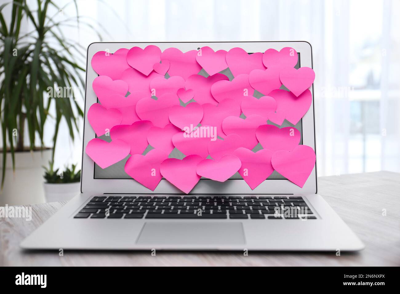 Heart shaped sticky notes on notebook at workplace. Valentine's Day ...