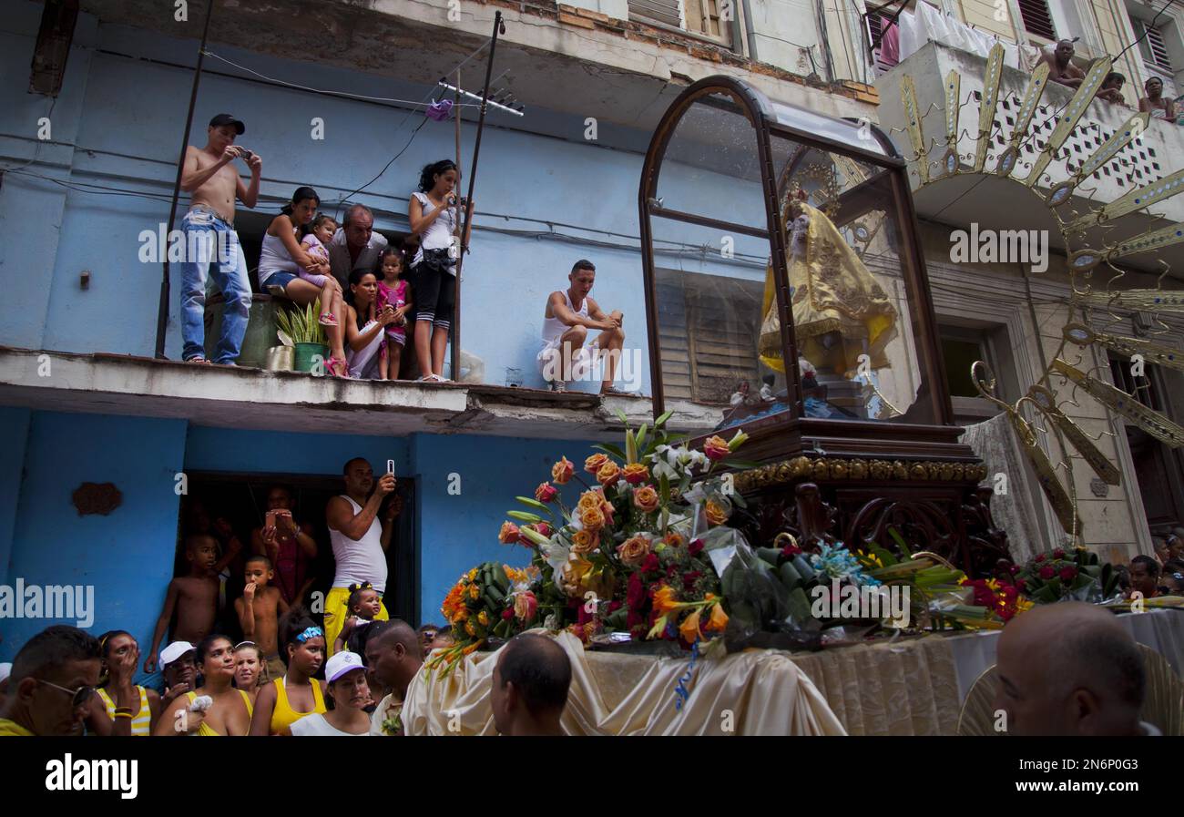 People look a statue of the Virgin of Charity of Cobre, during the ...