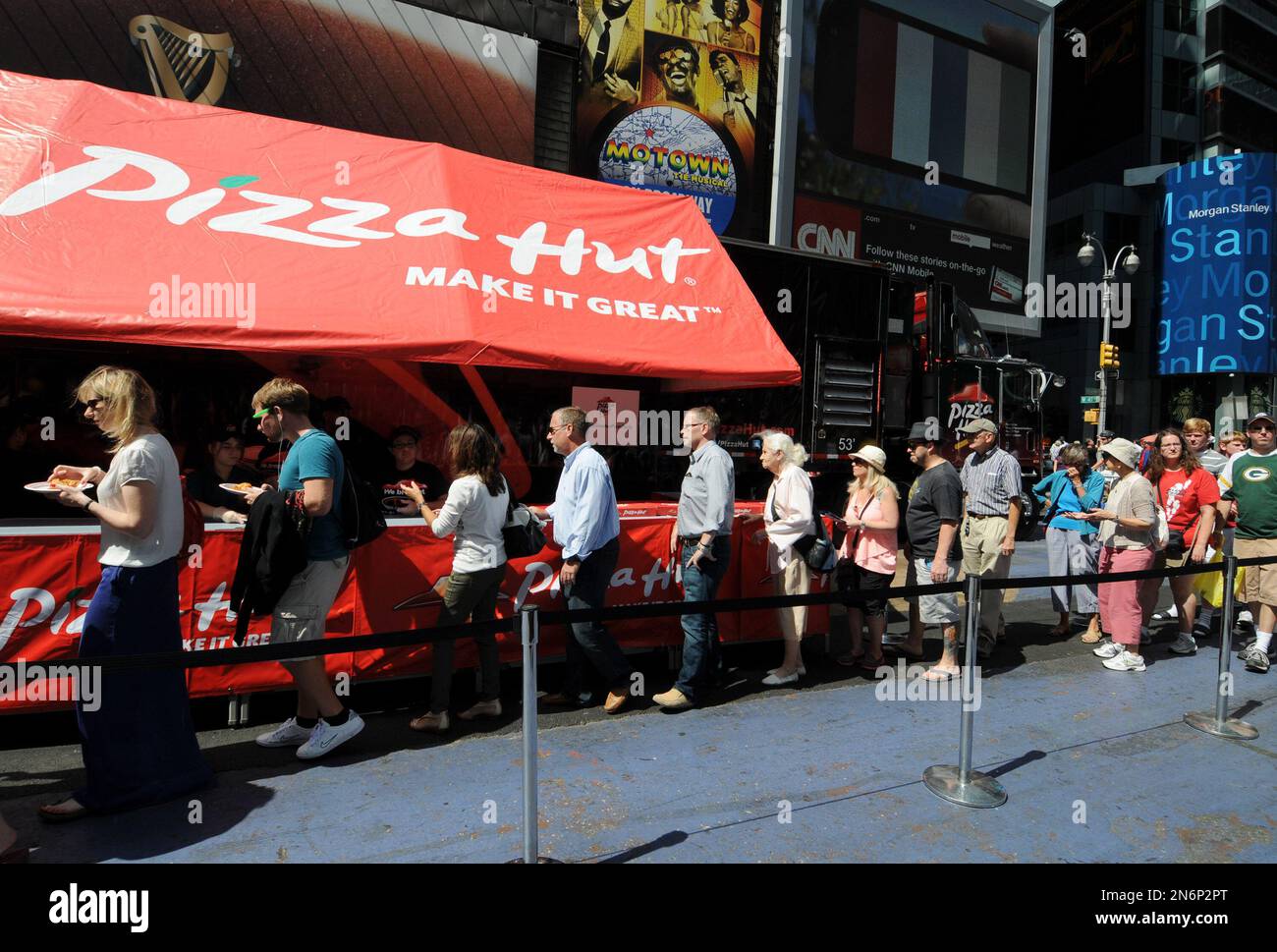 Fans enjoy Pizza Hut pizza in Times Square during The World's Greatest