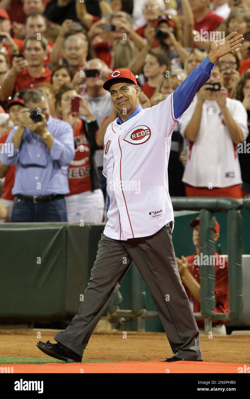 Former Cincinnati Reds player Cesar Geronimo walks onto the field during  ceremonies honoring the starting eight of the 1975-76 World Champion  Cincinnati Reds following a baseball game between the Cincinnati Reds and
