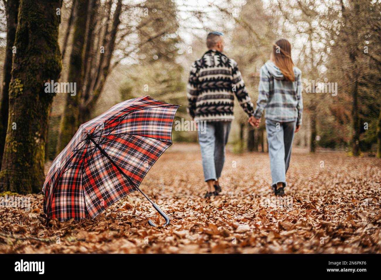 Young couple walking away from camera hi-res stock photography and ...