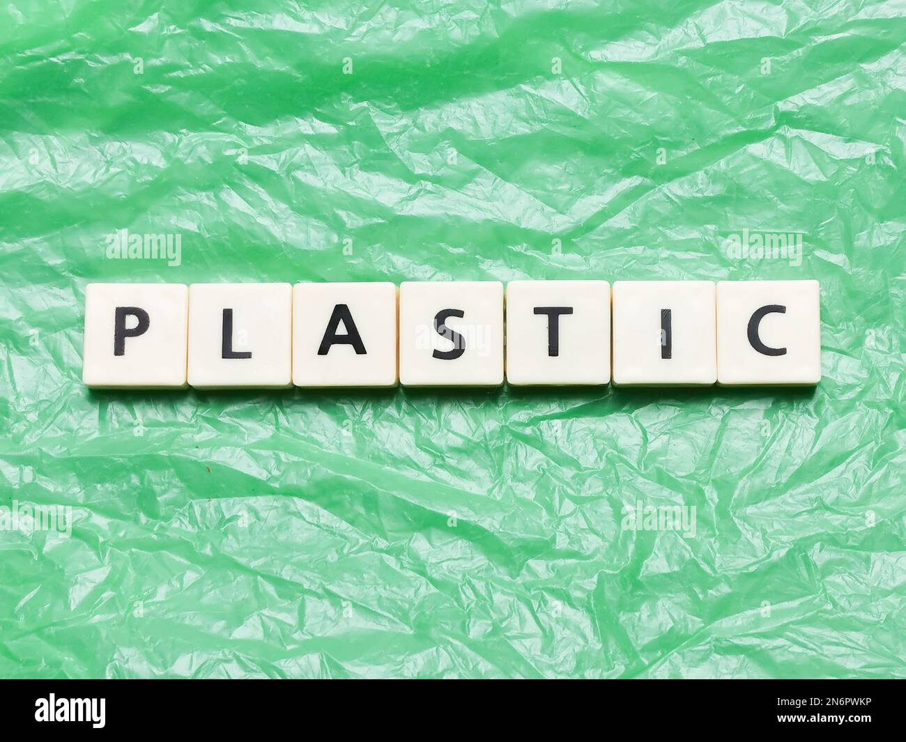 Word plastic made of square letter tiles on plastic bag. Environment