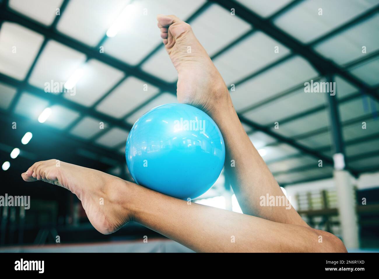 Feet, gymnastics and woman with ball for competition, practice or event