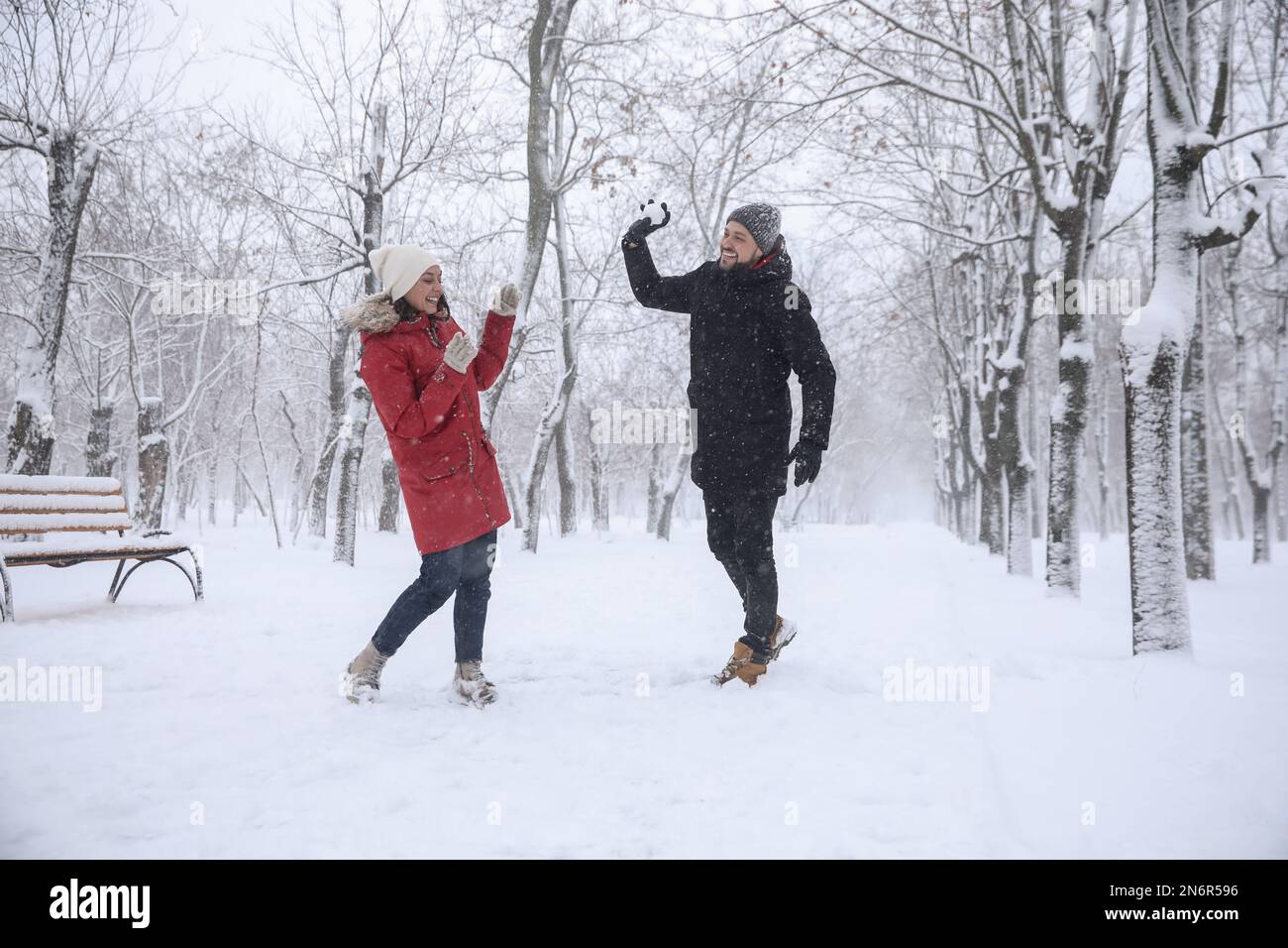 Happy couple having fun outside on winter day. Christmas vacation Stock Photo