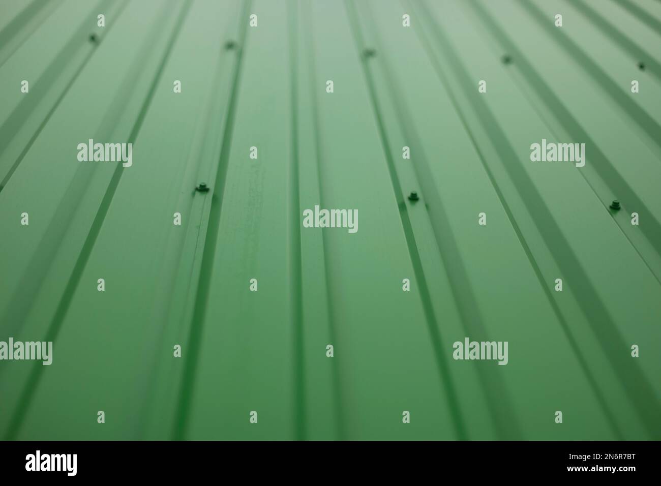 Green steel wall. Details of cladding of building. Steel profile Stock