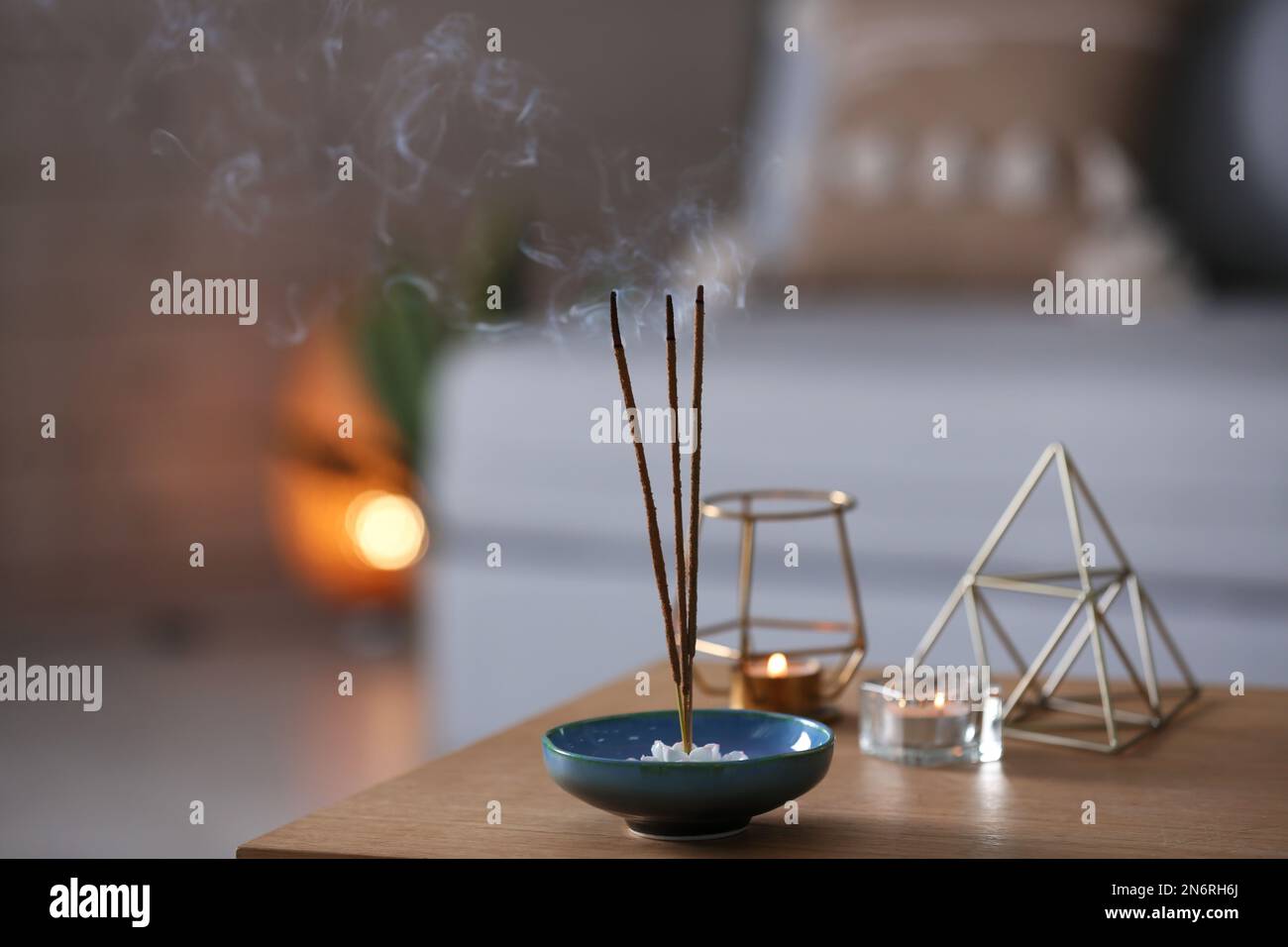 Incense sticks smoldering on table indoors, space for text Stock Photo ...