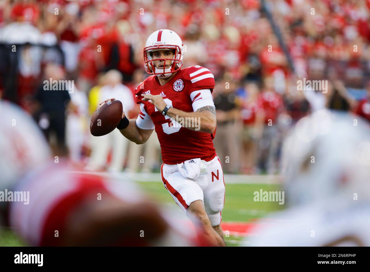 Nebraska quarterback Taylor Martinez carries the ball in the first half