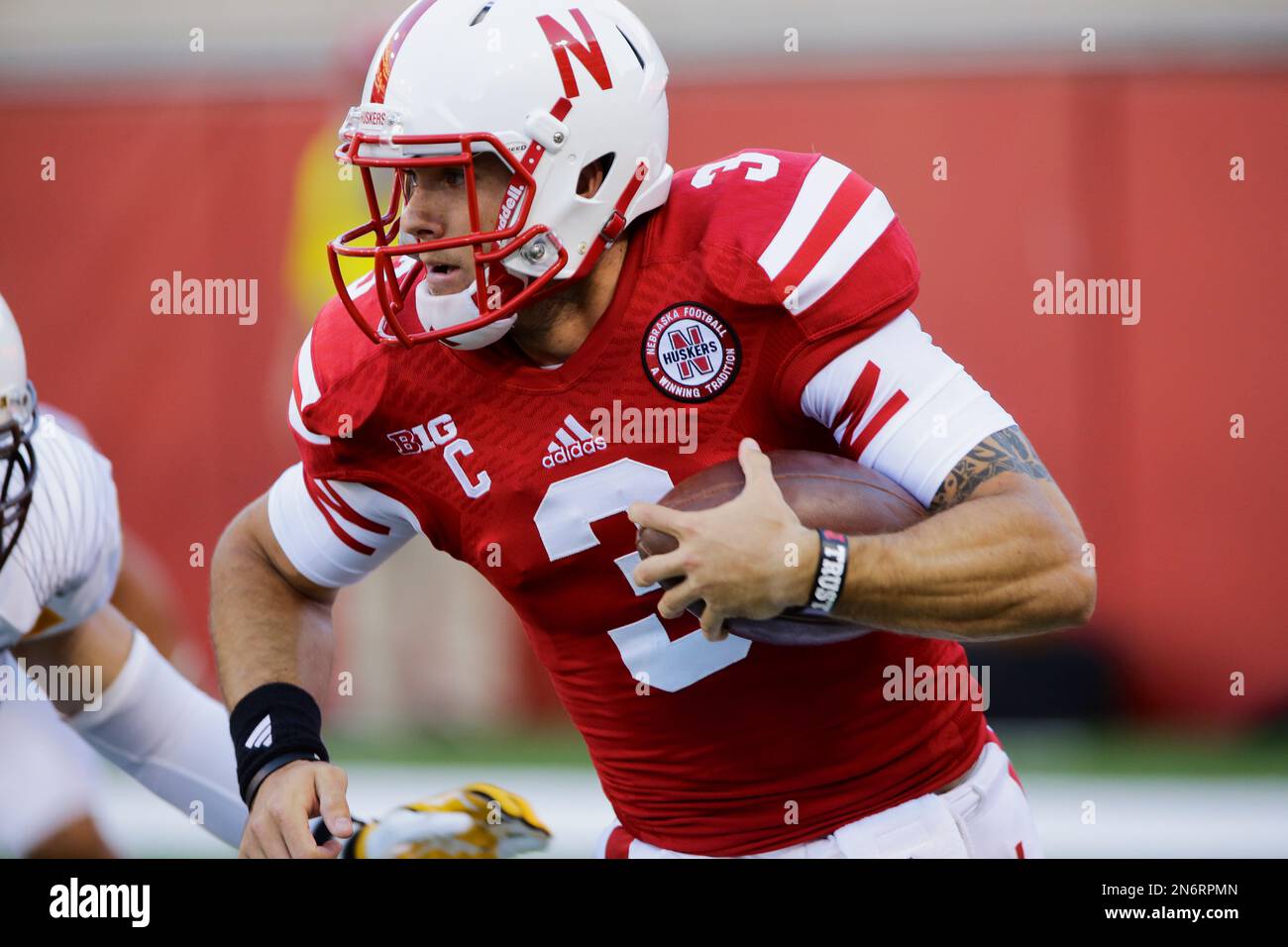 Nebraska quarterback Taylor Martinez carries the ball in the first half