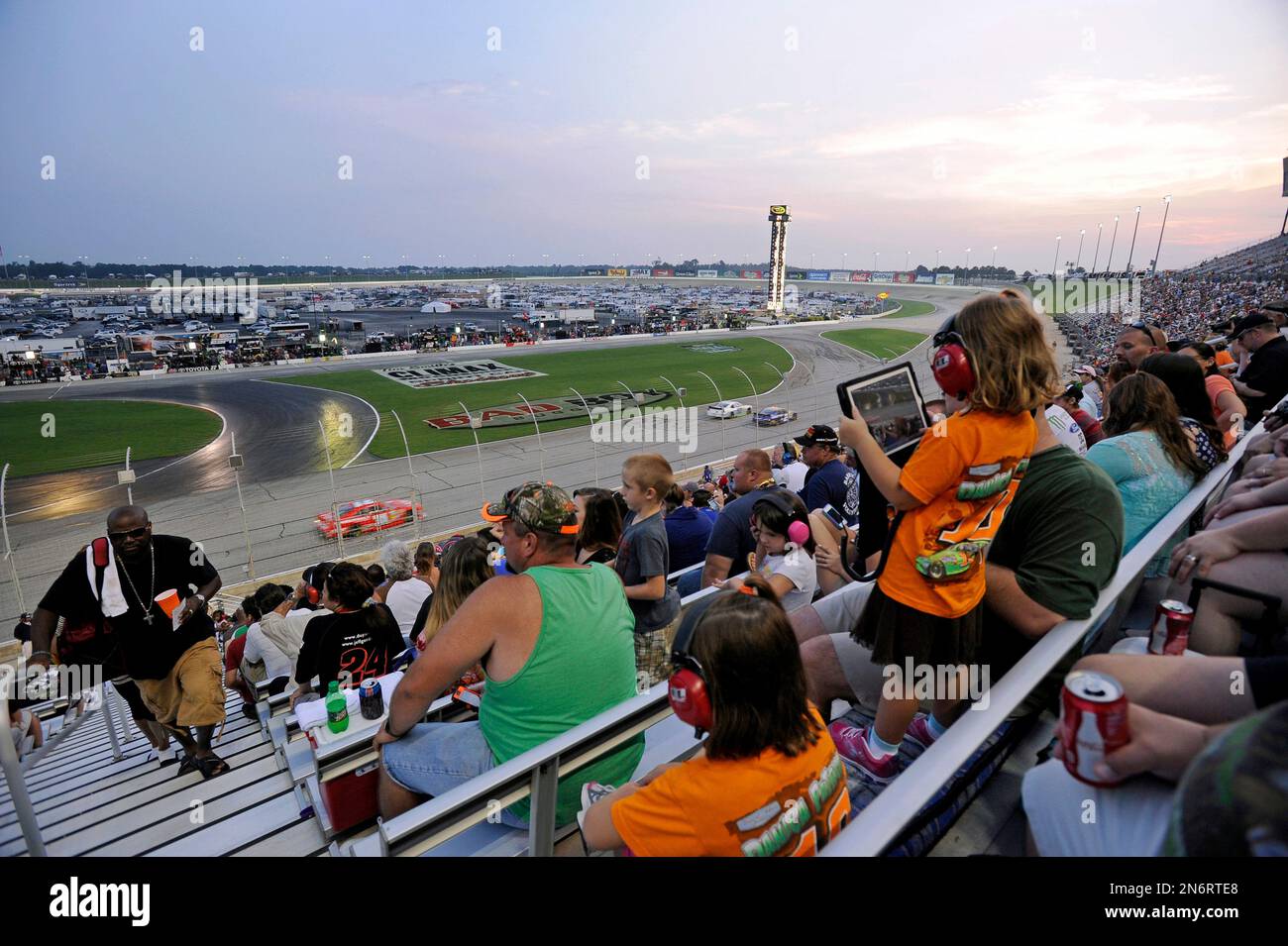 Racing fans in the main grandstand watch the first laps of the