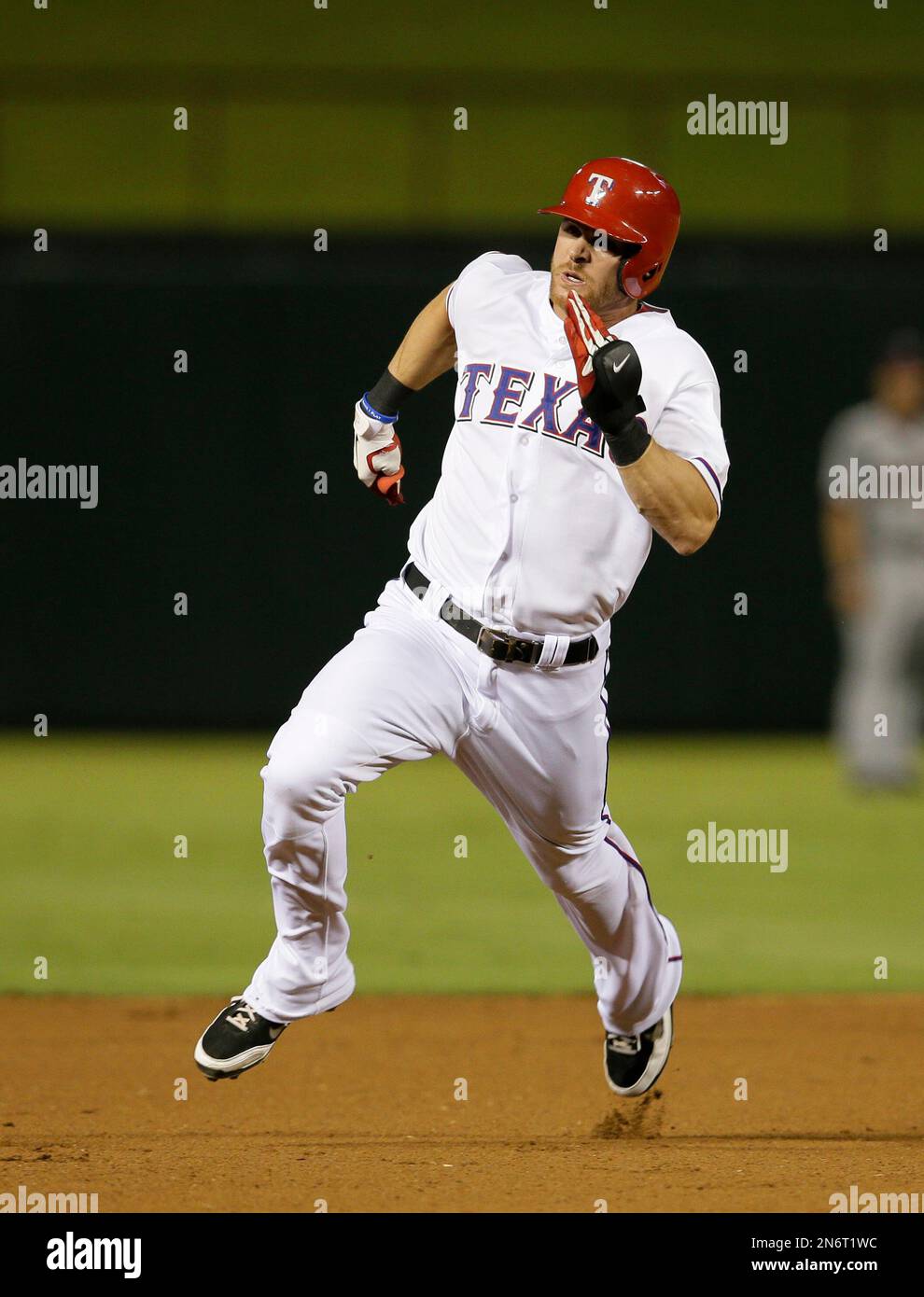 Texas Rangers' Craig Gentry (23) heads for third on his triple in the  seventh inning of a baseball game against the Minnesota Twins, Friday, Aug.  30, 2013, in Arlington, Texas. The Rangers