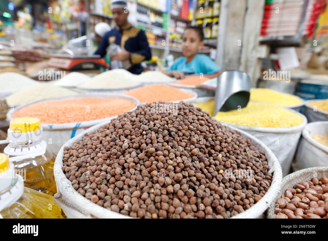 Dhaka, Bangladesh - February 10, 2023: Bangladeshi grocery vendors wait ...