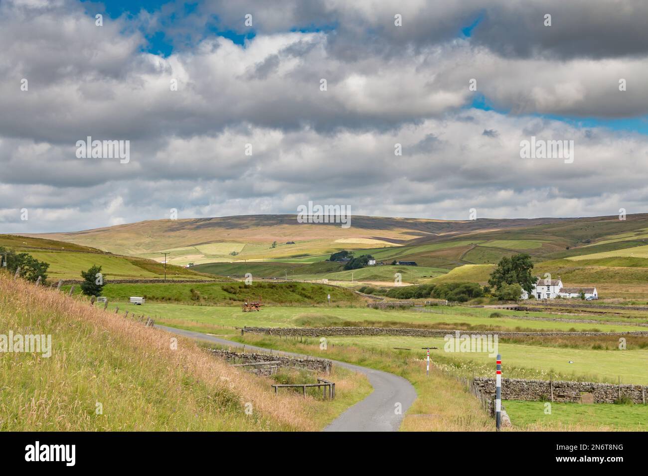 Patchy Sunshine and shadows across the landscape in this view of Harwood, Upper Teesdale. Stock Photo