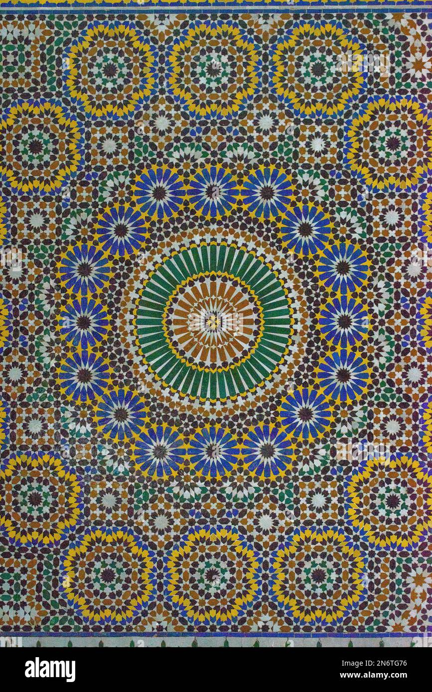 Stunning mosaic tiles from Marrakech, Morocco create a kaleidoscope of colors and patterns, captivating the eye and transporting you to another world. Stock Photo