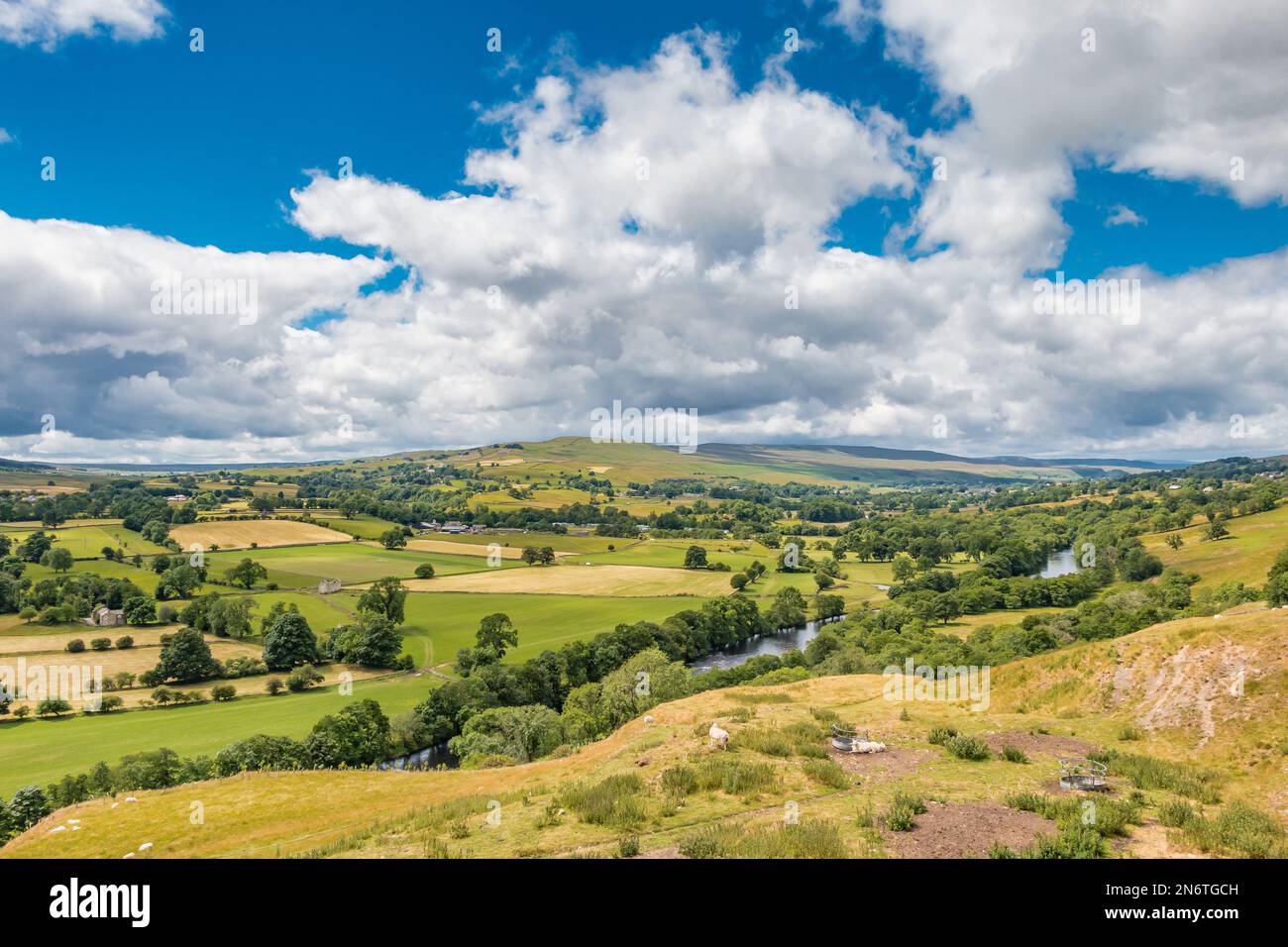 The iconic view from Whistle Crag in strong summer sunshine under a big sky.  This view takes in Grassholme dam at the lower end of Lunedale Stock Photo