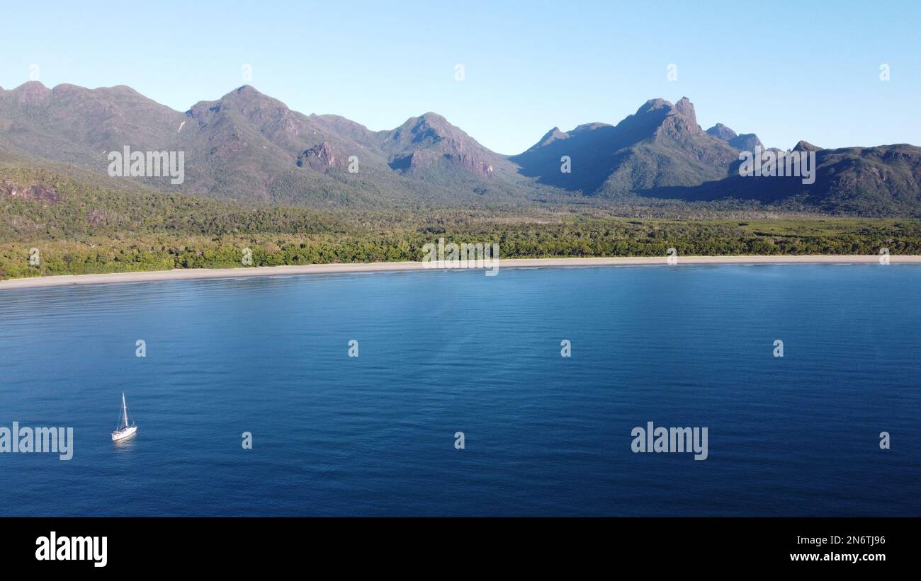 Aerial shot of Zoe Bay with a sailing boat anchored by the beach and