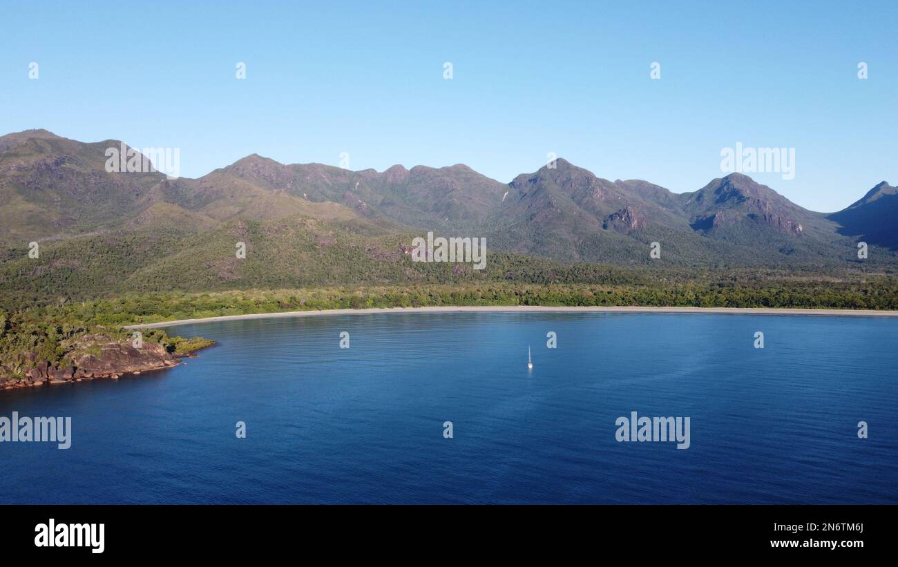Aerial shot of Zoe Bay with a sailing boat anchored in front of the