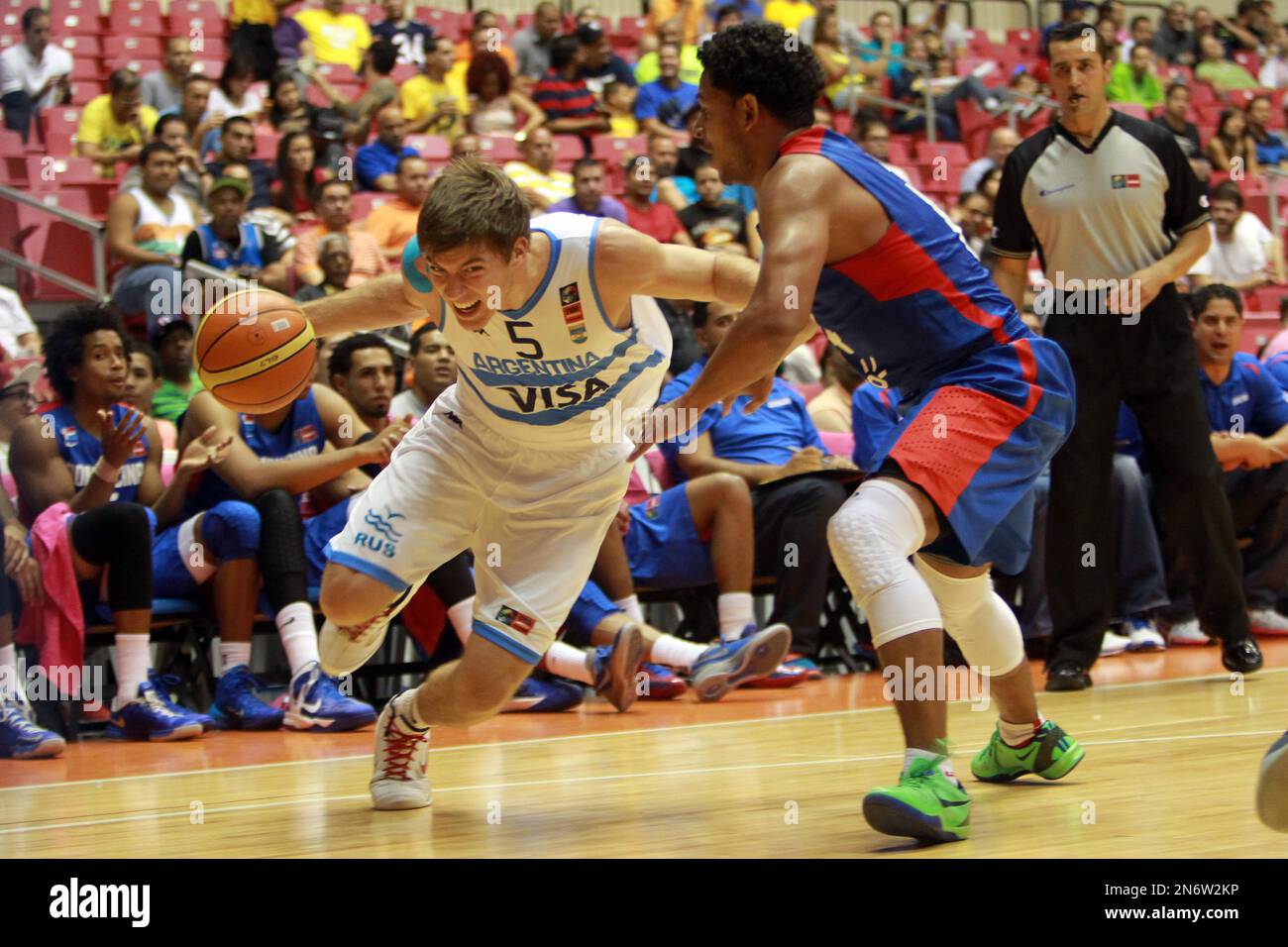 Dominican Republic’s Ronald Ramon, right, pressures Argentina’s Juan