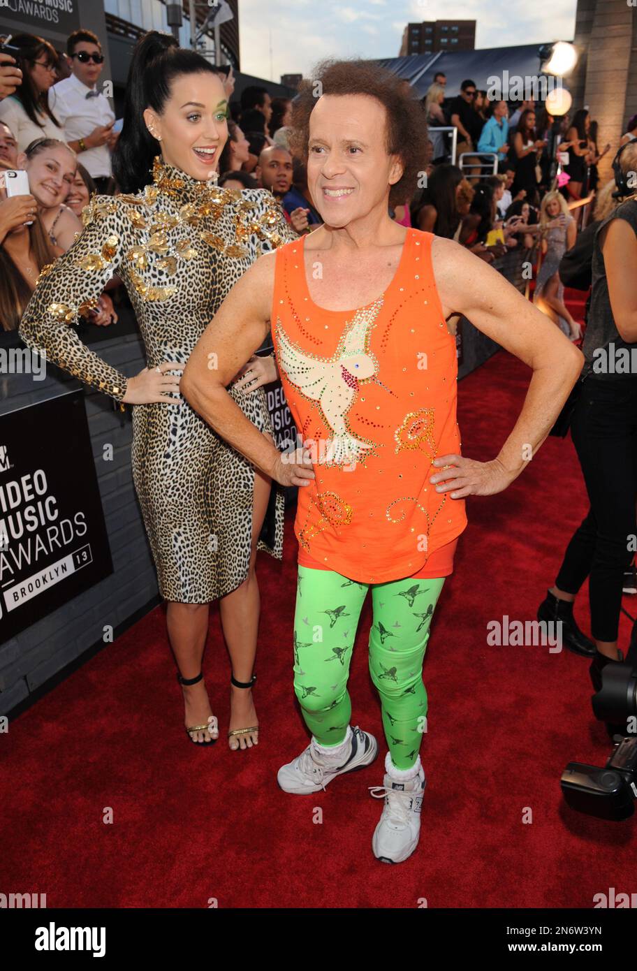 Singer Katy Perry, left, and fitness guru Richard Simmons poses at the