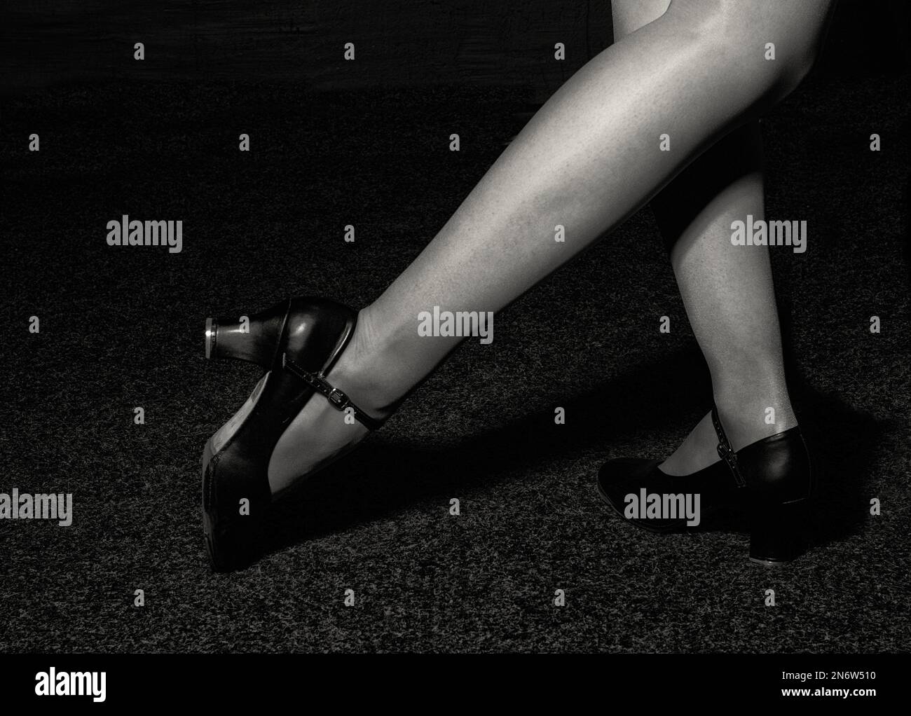 Artistic tap dancer legs dancing tap, legs fragment close up croped