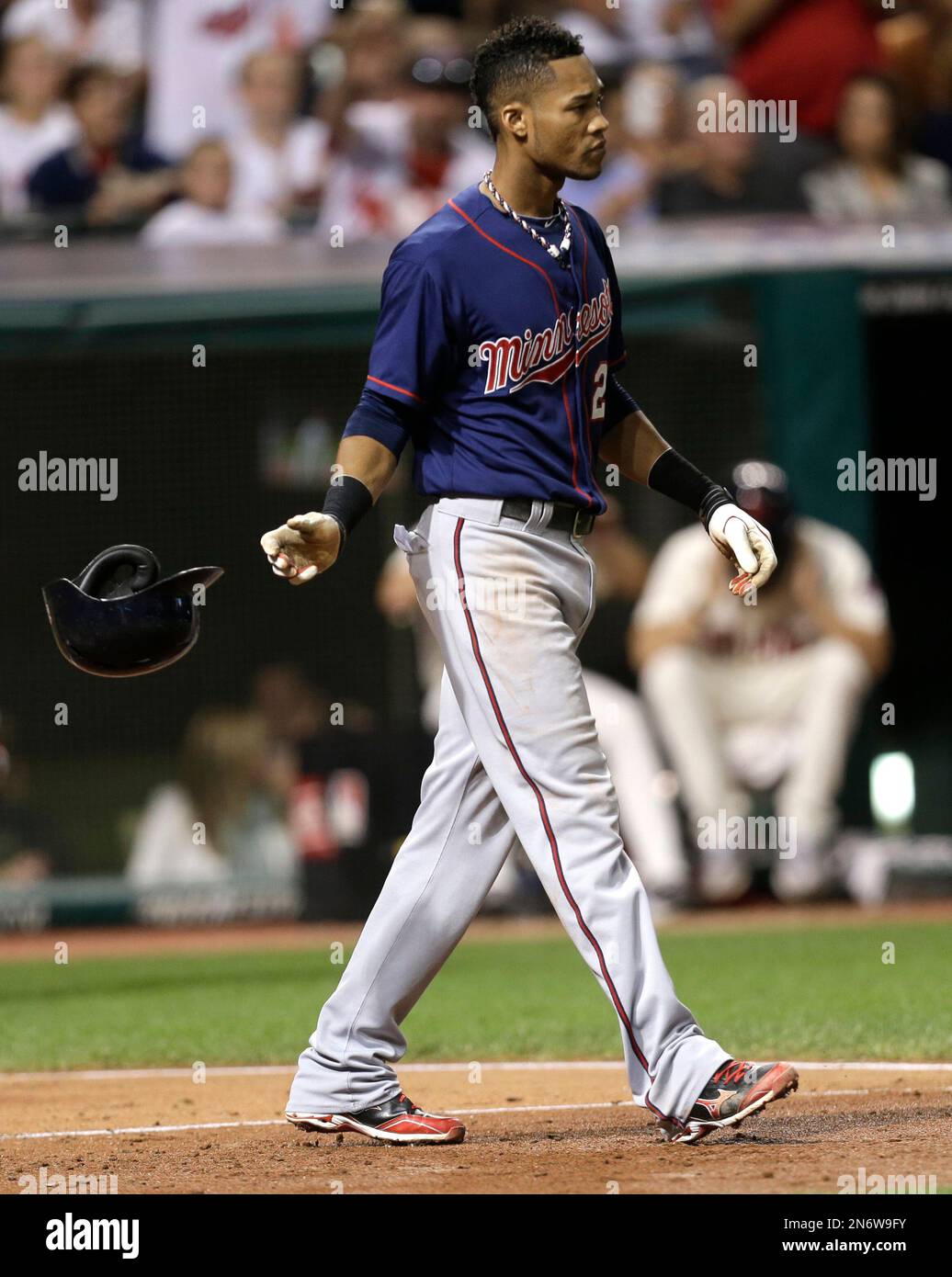 Minnesota Twins' Pedro Florimon tosses his helmet after striking out