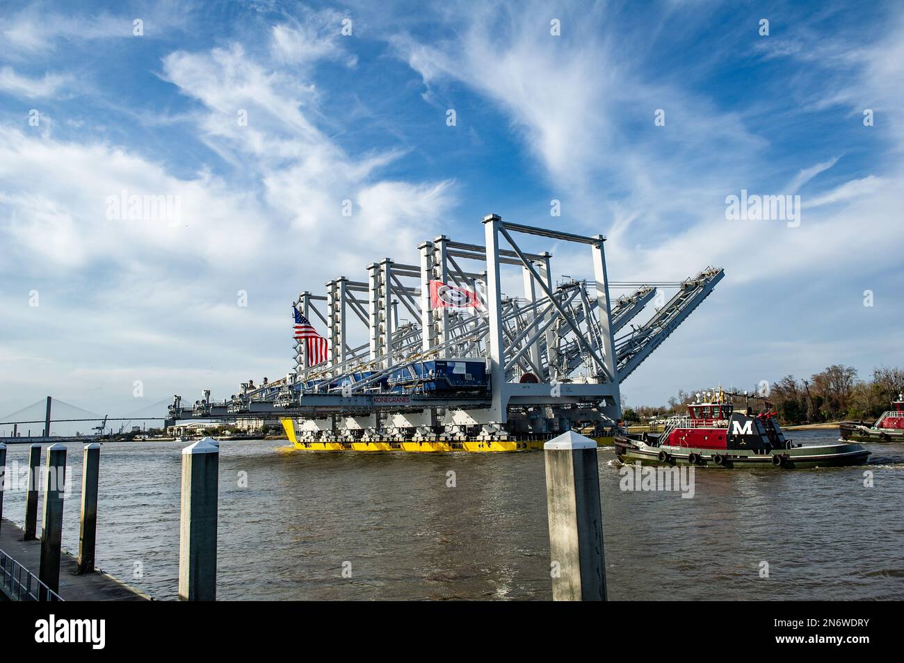 The Port of Savannah received a massive delivery Thursday: four towering ship-to-shore cranes delivered on heavy load carrier named BigLift Baffin. Stock Photo